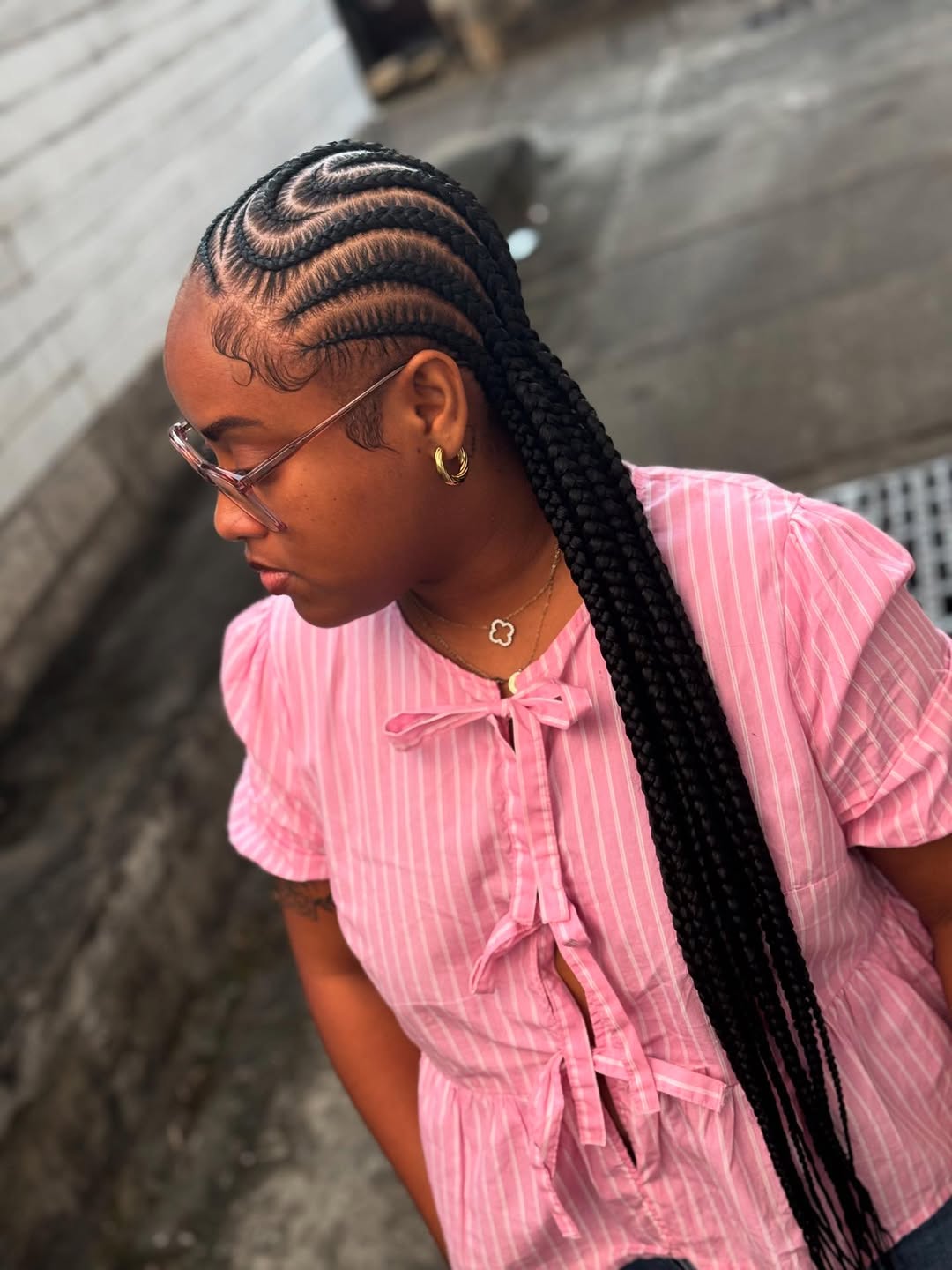Sleek Criss-Cross Cornrows with Long Braided Extensions