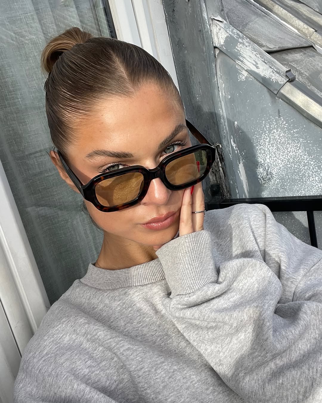 25 Sleek Hairstyles 2026 You Need To Try Now 19 Sleek High Bun With Middle Part