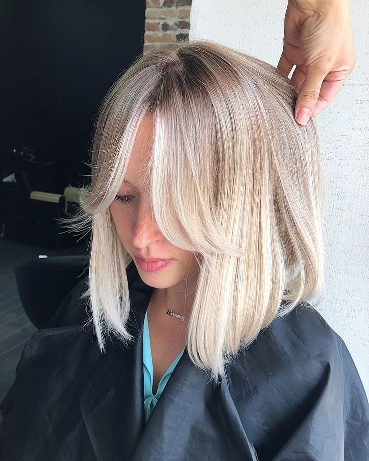 Sleek Platinum Blonde Lob With Soft Curtain Bangs