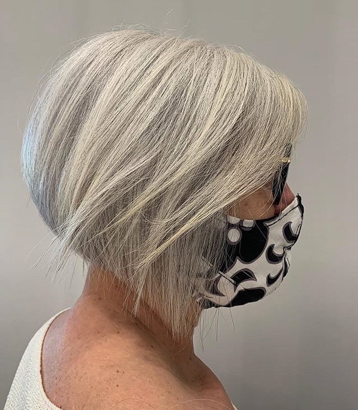 25 Stunning Hairstyles for Older Women in 2026 13 Sleek Silver Tapered Bob With Side Part