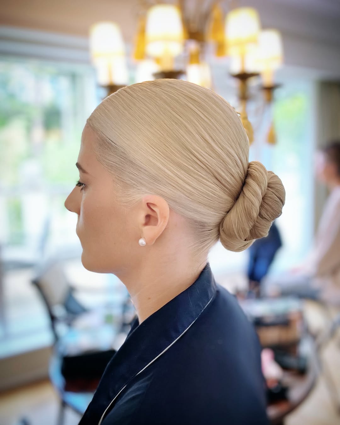 25 Sleek Hairstyles 2026 You Need To Try Now 27 Sleek Twisted Bun On Platinum Blonde