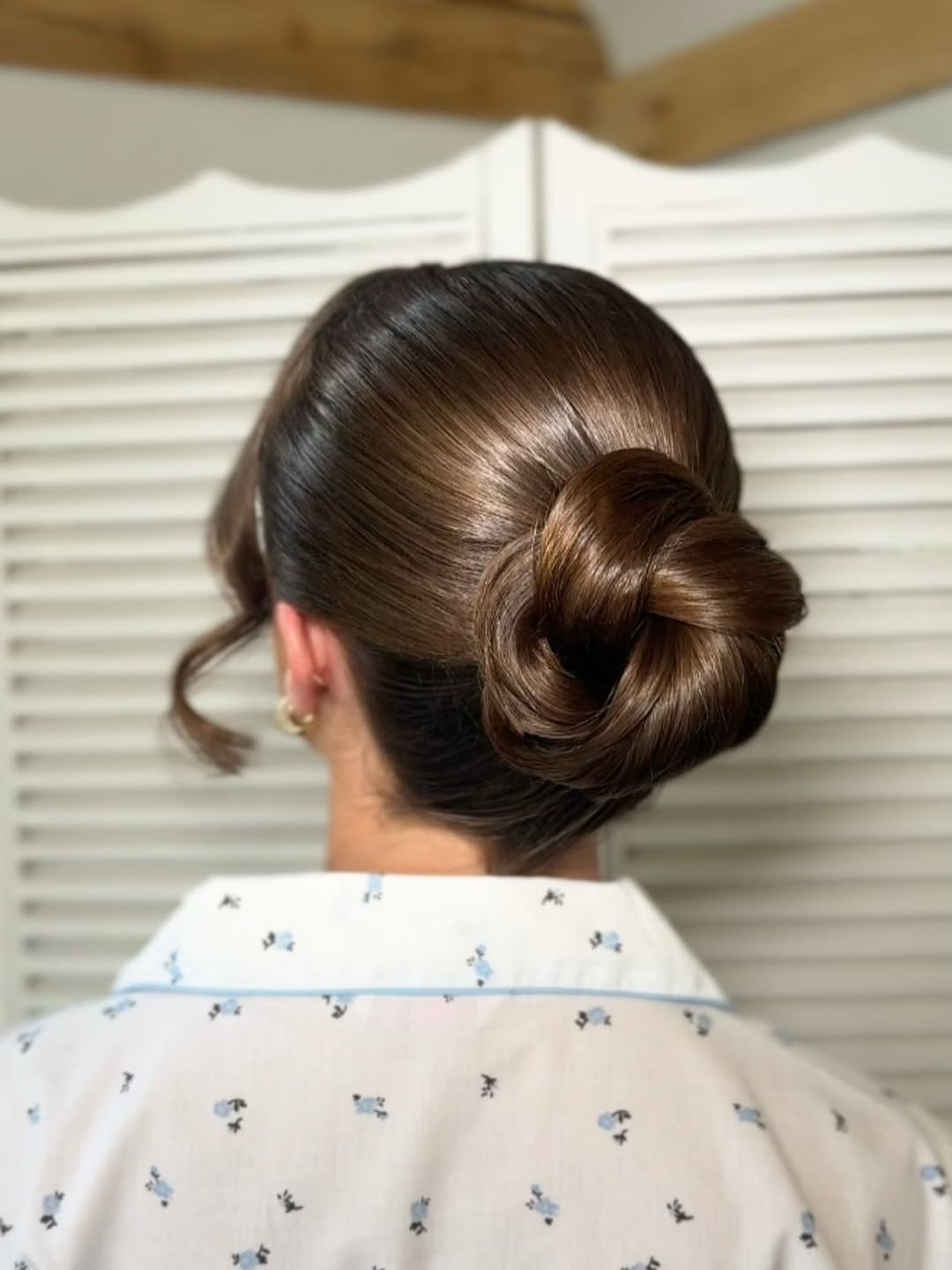 25 Sleek Hairstyles 2026 You Need To Try Now 6 Sleek Twisted Low Bun With Face Framing Tendrils