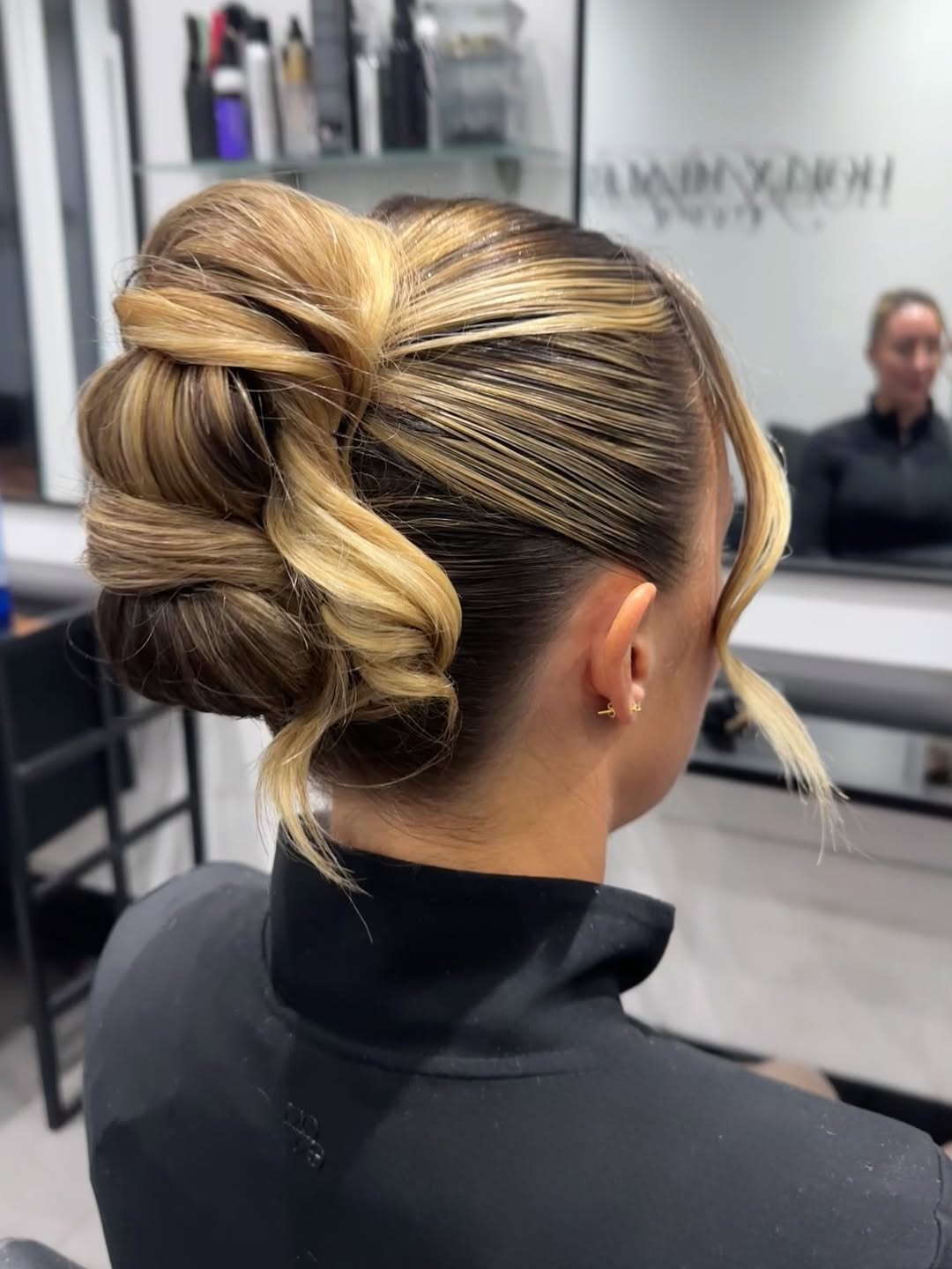25 Sleek Hairstyles 2026 You Need To Try Now 10 Sleek Twisted Updo With Face Framing Tendrils