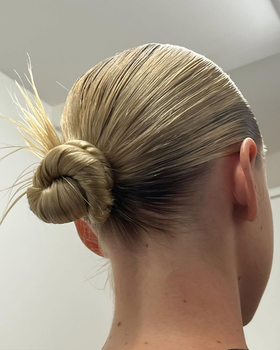 25 Sleek Hairstyles 2026 You Need To Try Now 13 Sleek Wet Look Bun With Spiky Ends
