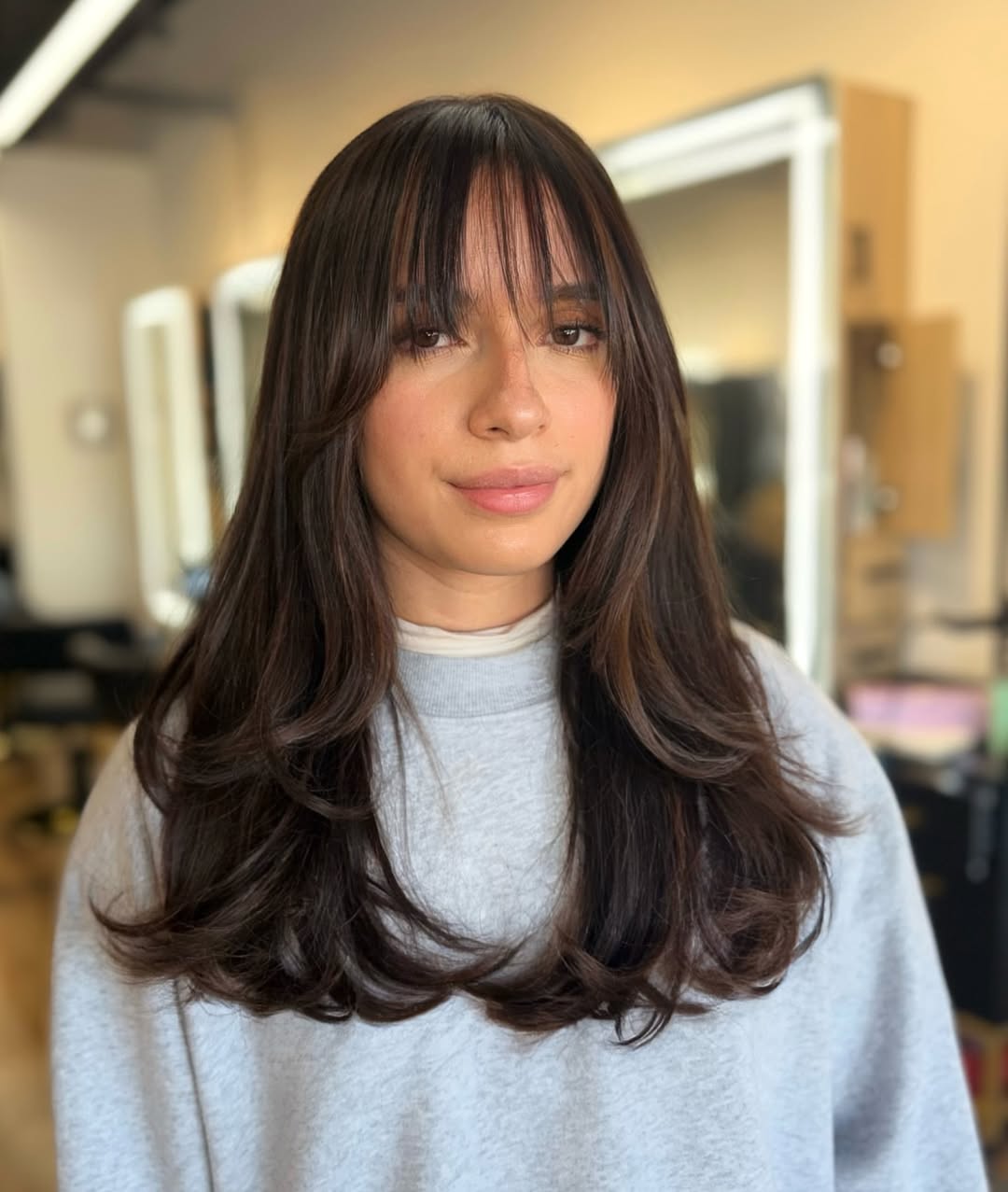 Soft Face-Framing Layers With Wispy Bangs