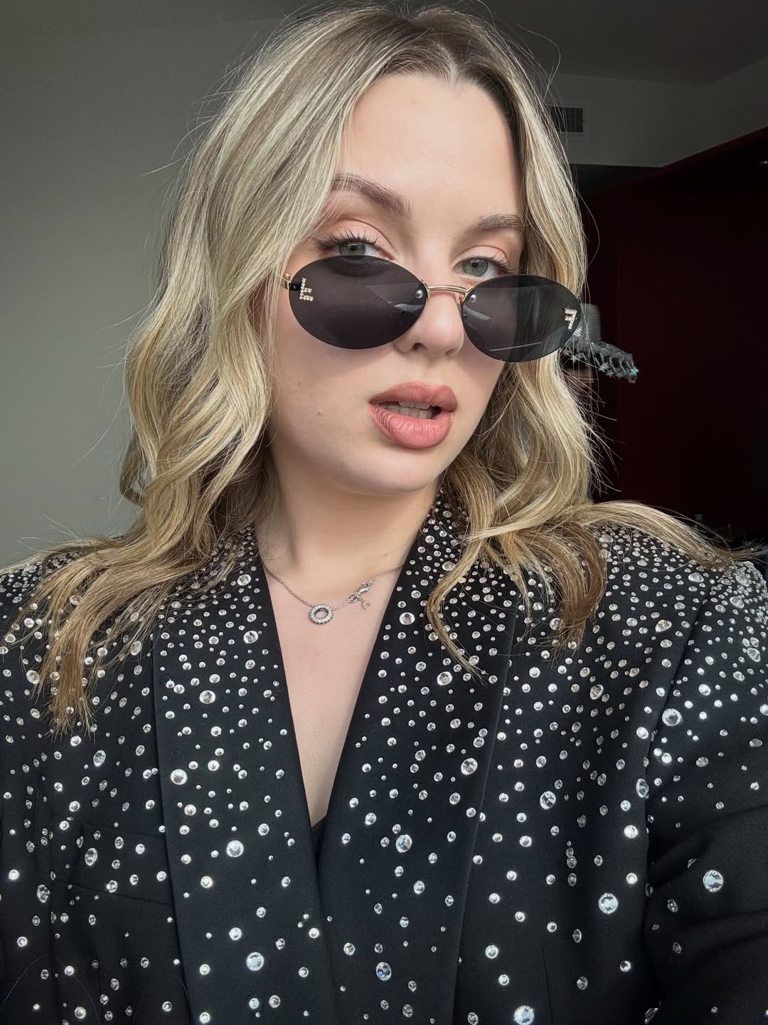25 Concert Outfit Ideas You Need for 2026 20 Sparkling Statement Blazer With Oval Sunglasses