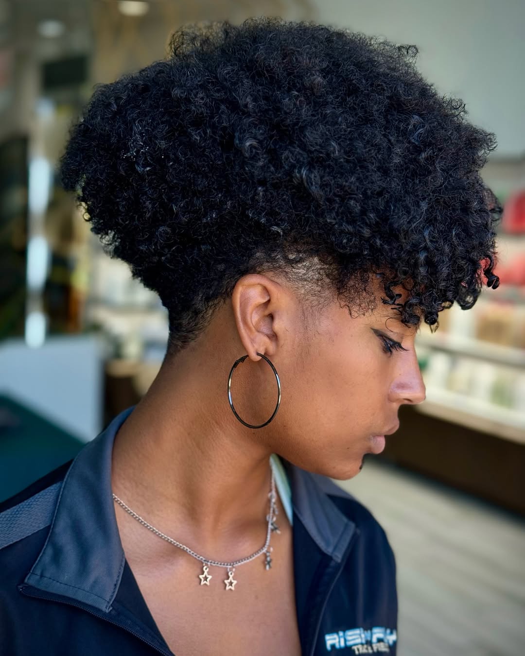 Textured Curly Pixie With Faded Sides And Volume