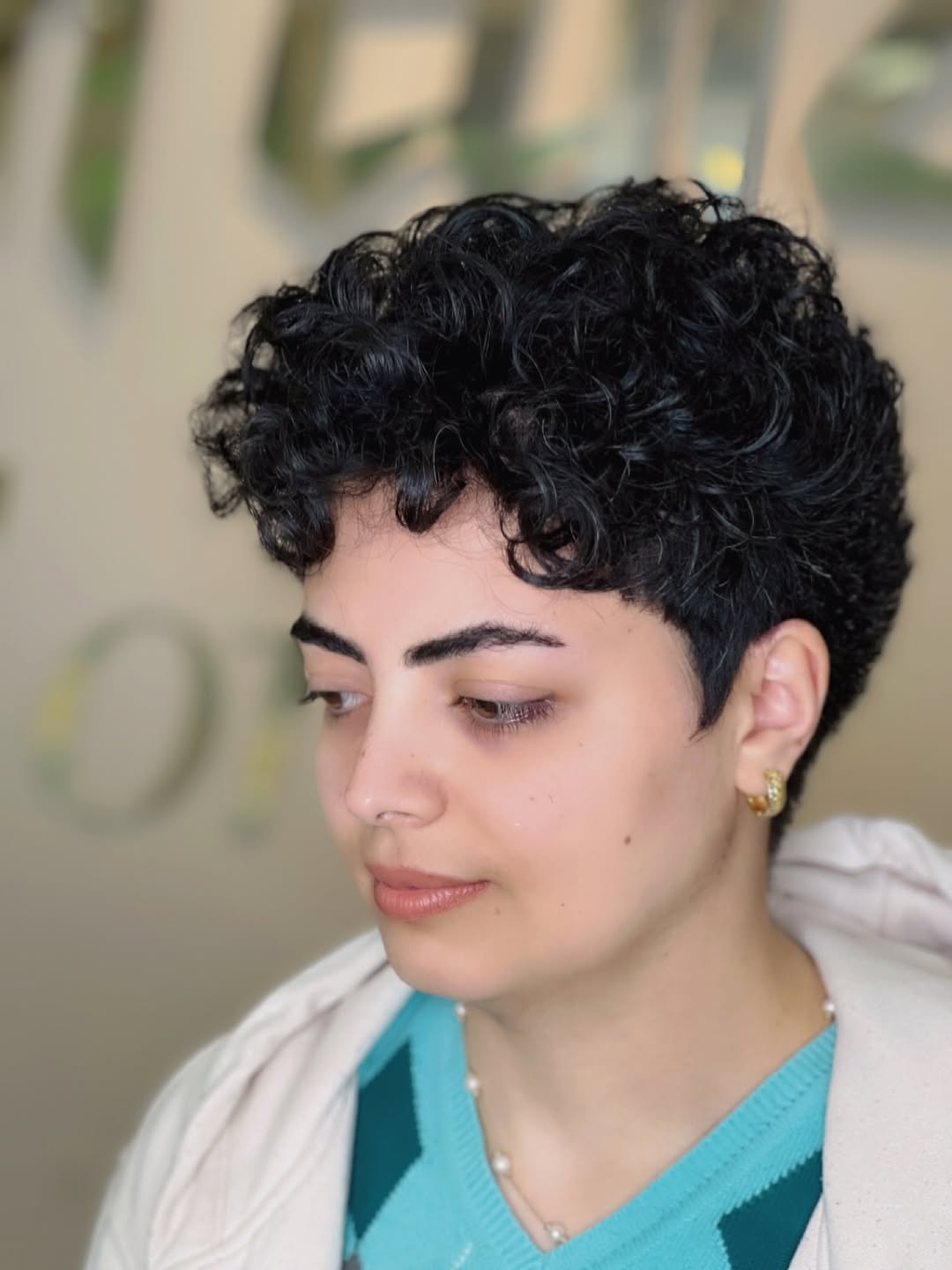 Textured Jet Black Curly Pixie with Undercut