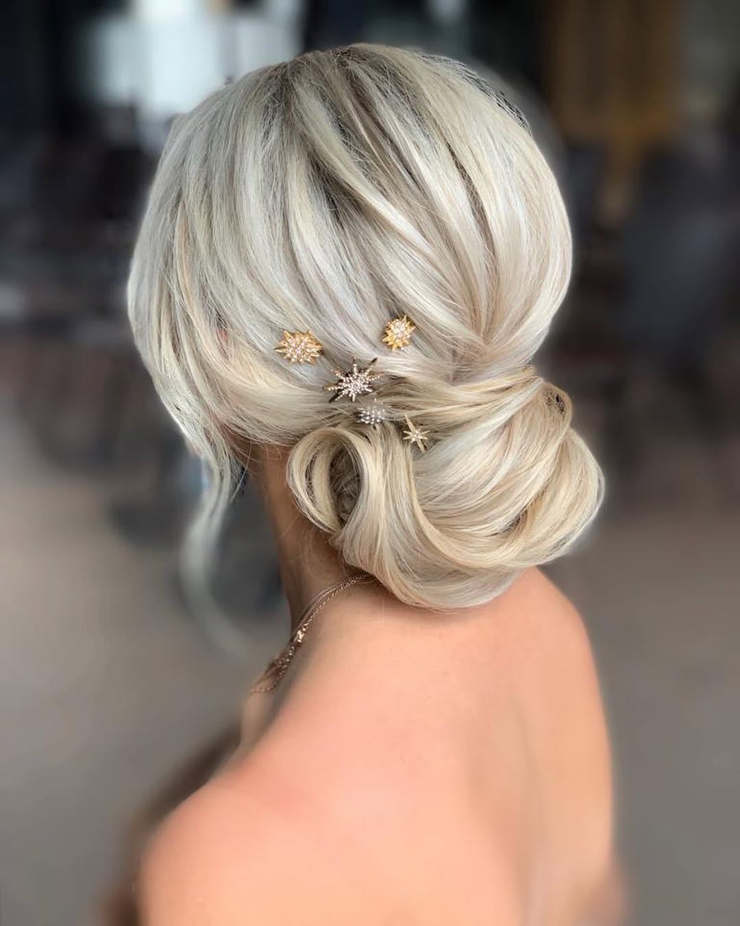 Textured Low Bun With Sparkling Star Hairpins