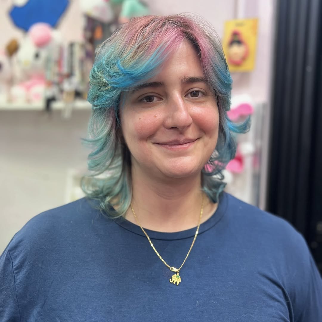 Vibrant Blue And Pink Wolf Cut With Full Bangs