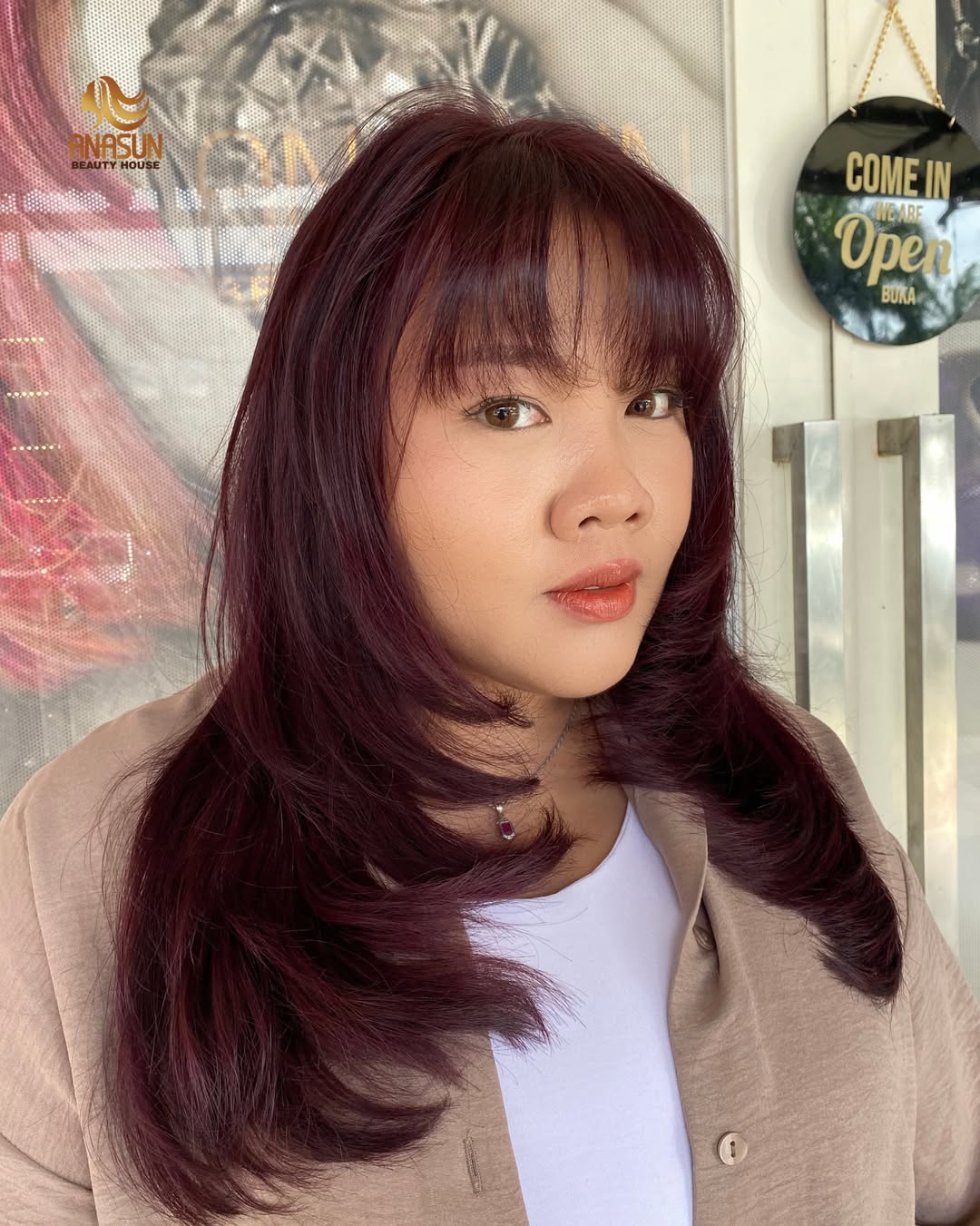Vibrant Cherry Brown Layers With Wispy Bangs