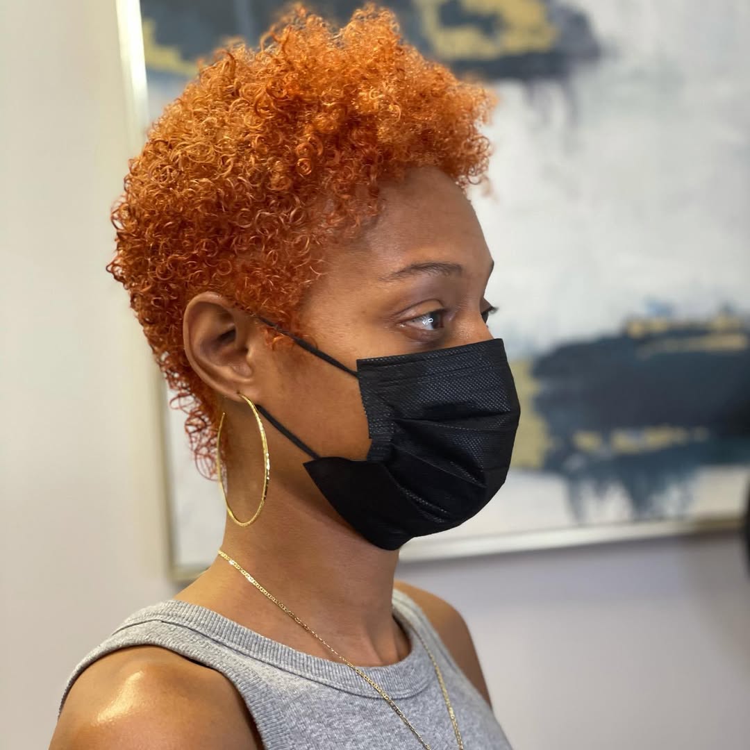 Vibrant Copper Coily Pixie Cut With Defined Curls