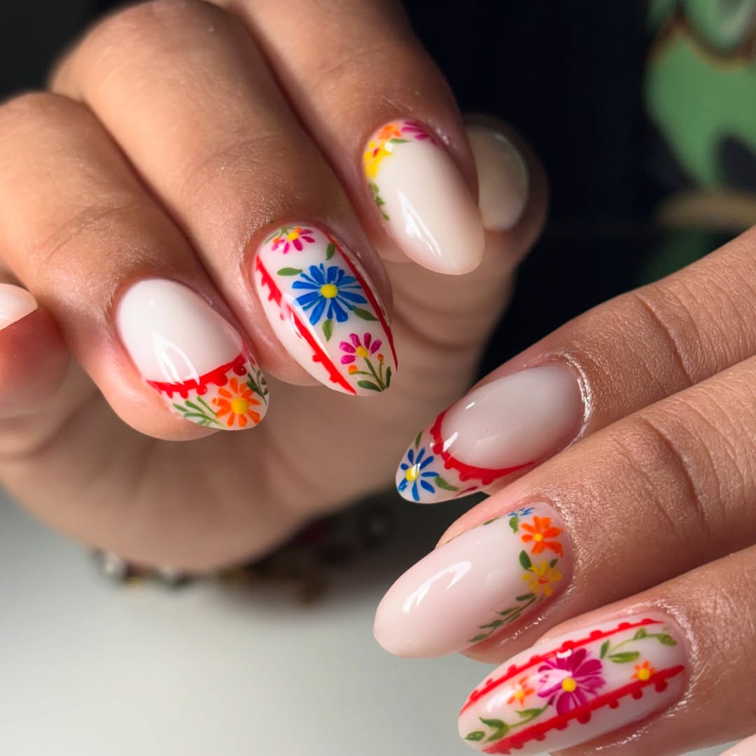 27 Stunning Mexican Nail Designs for 2026 11 Vibrant Folkloric Floral Almond Nails With Red Details