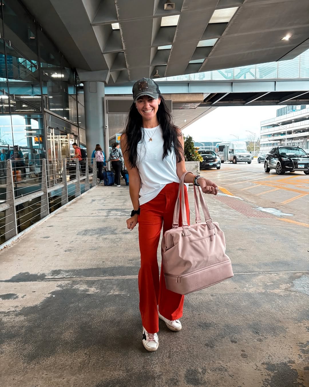 29 Work Outfits You Need for 2026 Trends 21 Vibrant Red Wide-Leg Trousers With White Tank