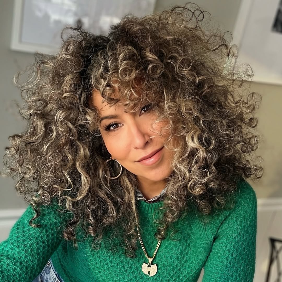 Voluminous Honey Blonde Curly Shag With Bangs