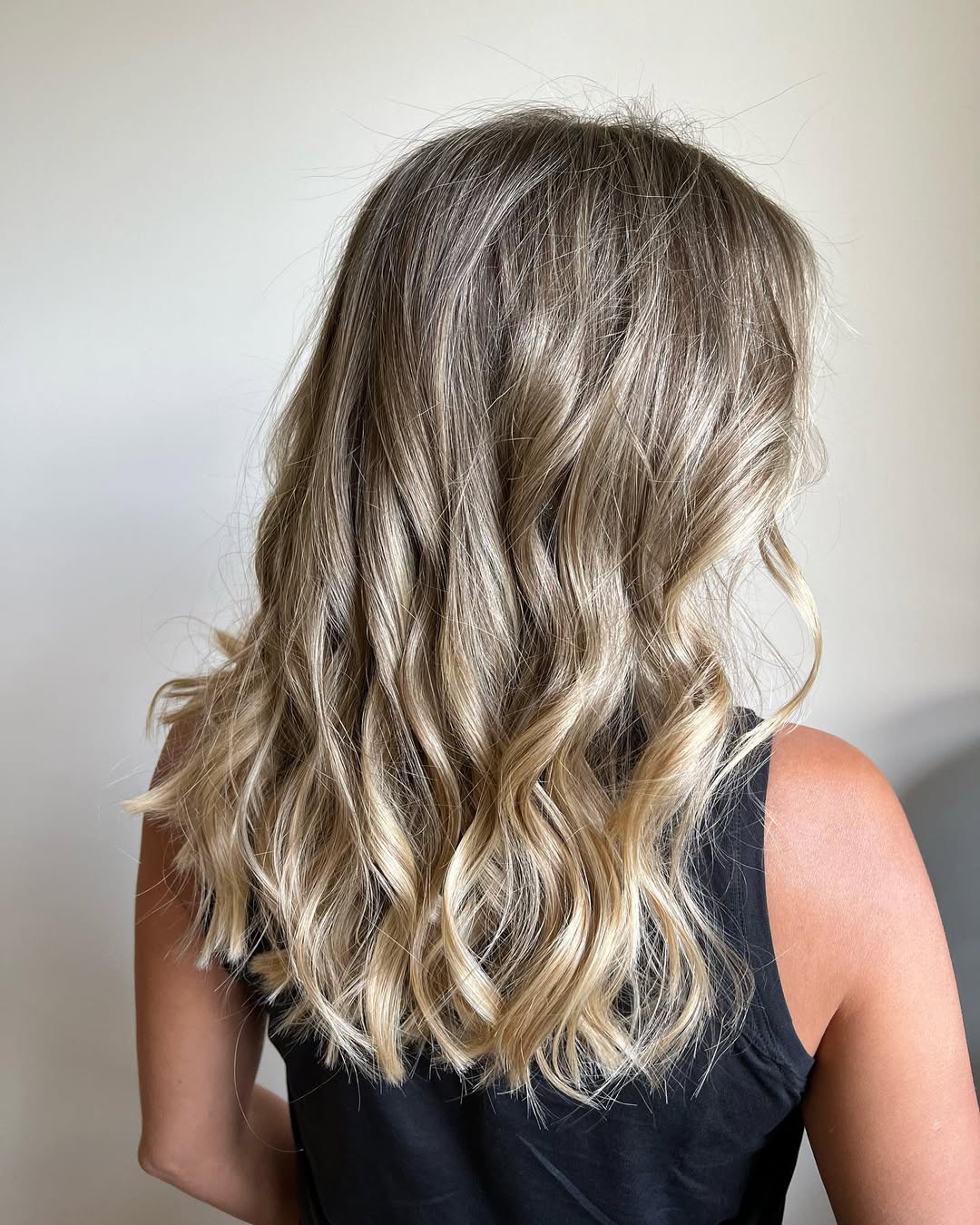 Warm Blonde Balayage With Lived-In Waves