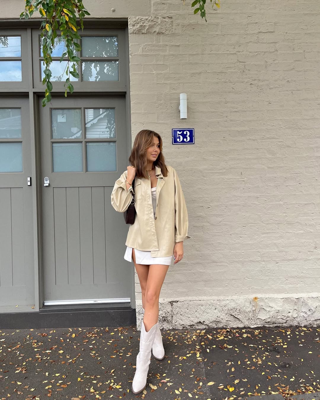 25 Cowboy Boot Outfits You Need for 2026 8 Western Chic White Mini Skirt With Cowboy Boots