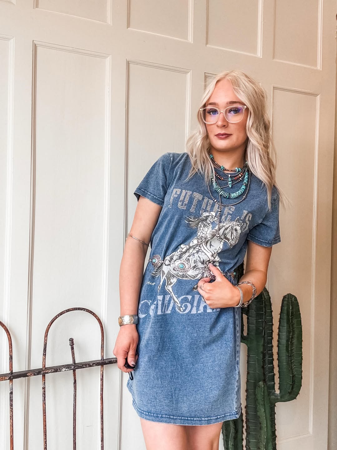 25 Concert Outfit Ideas You Need for 2026 18 Western Graphic Tee Dress With Turquoise Accessories