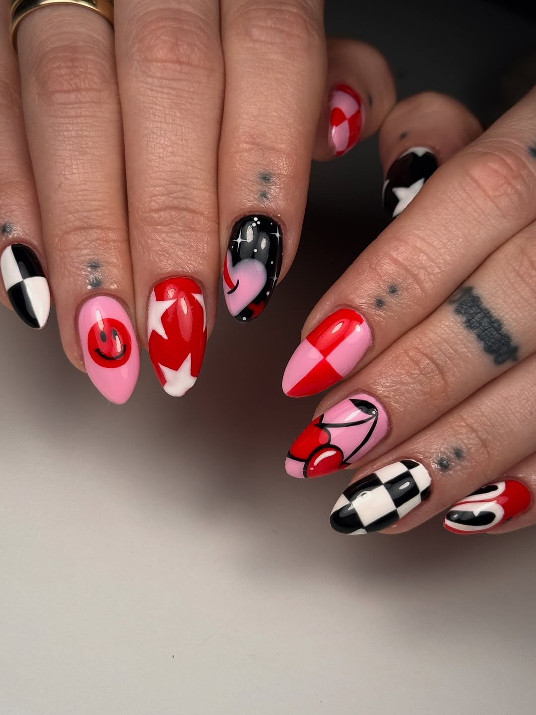 29 Checkerboard Nail Ideas for 2026 24 Whimsical Checkerboard Heart And Cherry Almond Nails