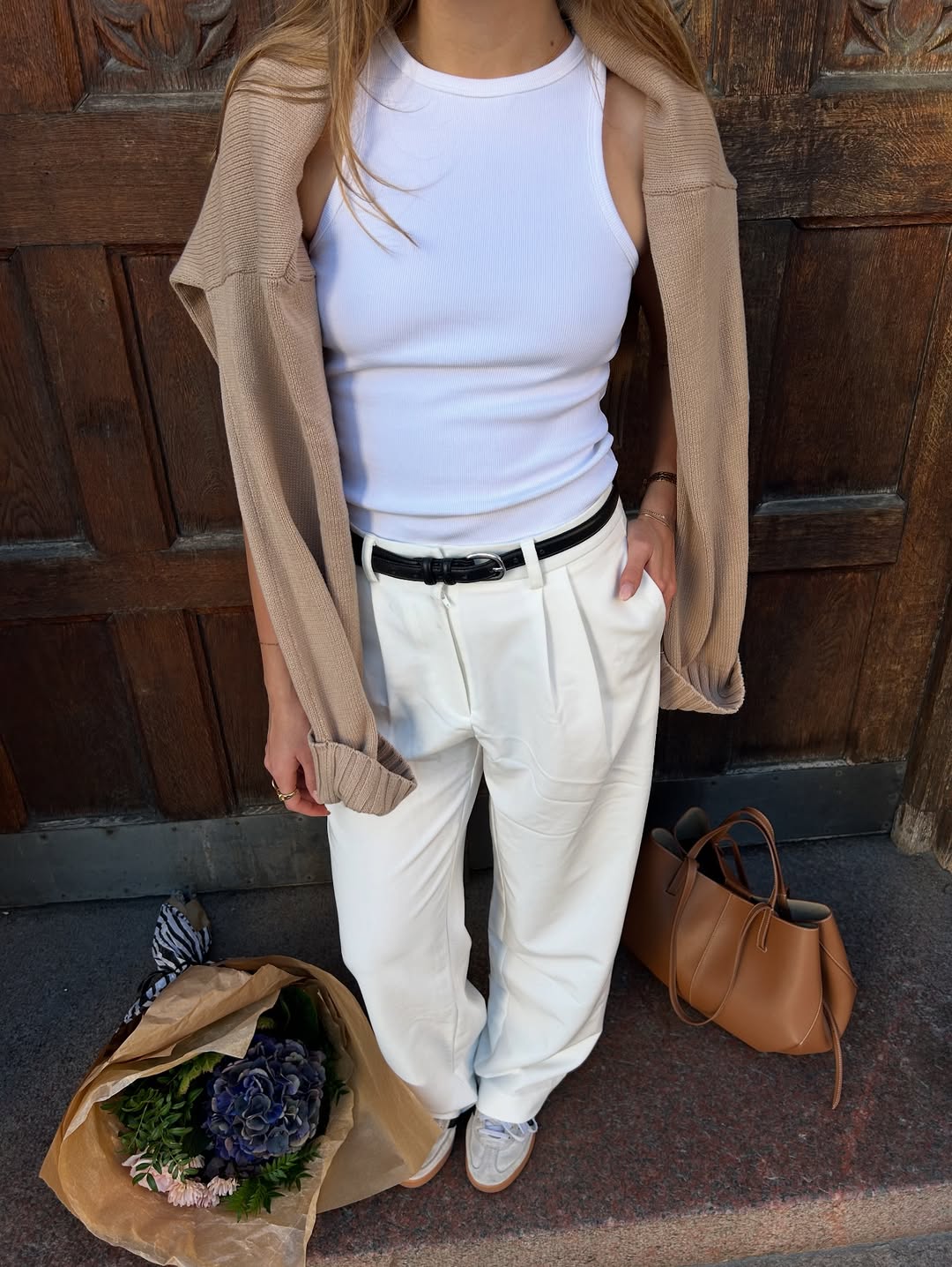 25 Early Fall Outfits You Need for 2026 20 White Ribbed Tank With Cream Pleated Trousers and Cardigan