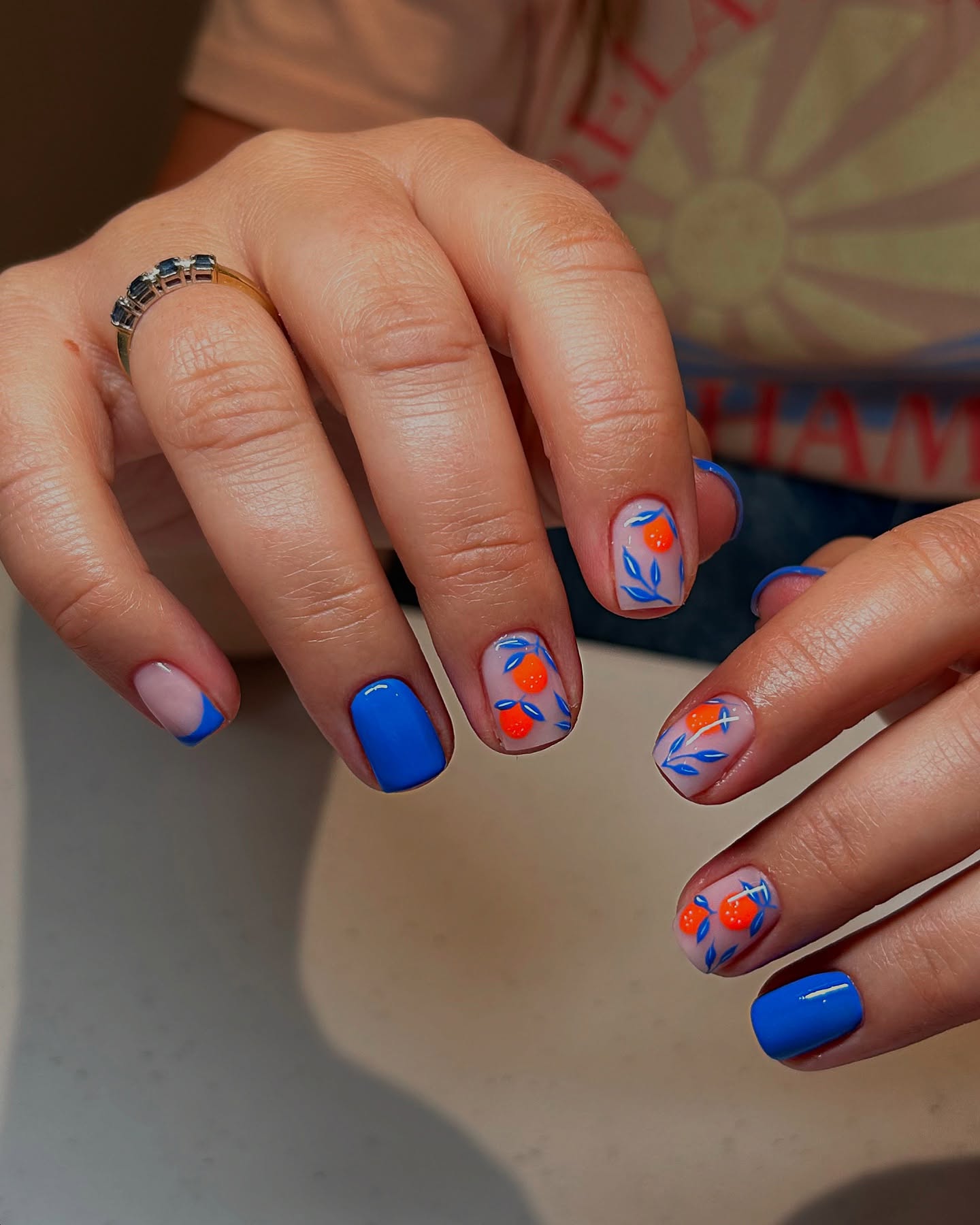 27 End of Summer Nail Ideas for 2026 27 Abstract Fruit & Blue French Short Nails