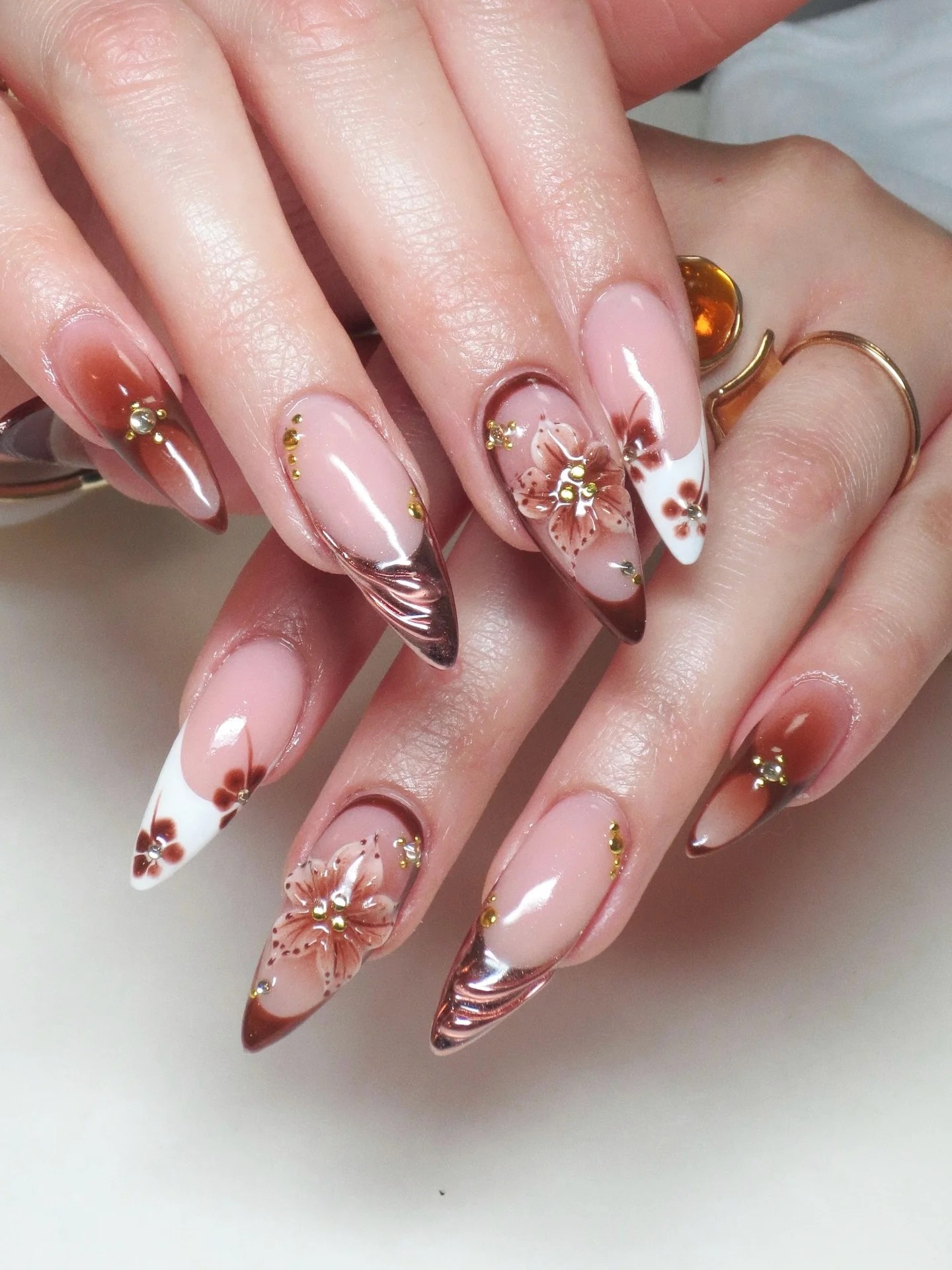 25 Fall Nail Ideas You Need to Try in 2026 10 Autumn Floral Ombre Stiletto Nails with Chrome Accent