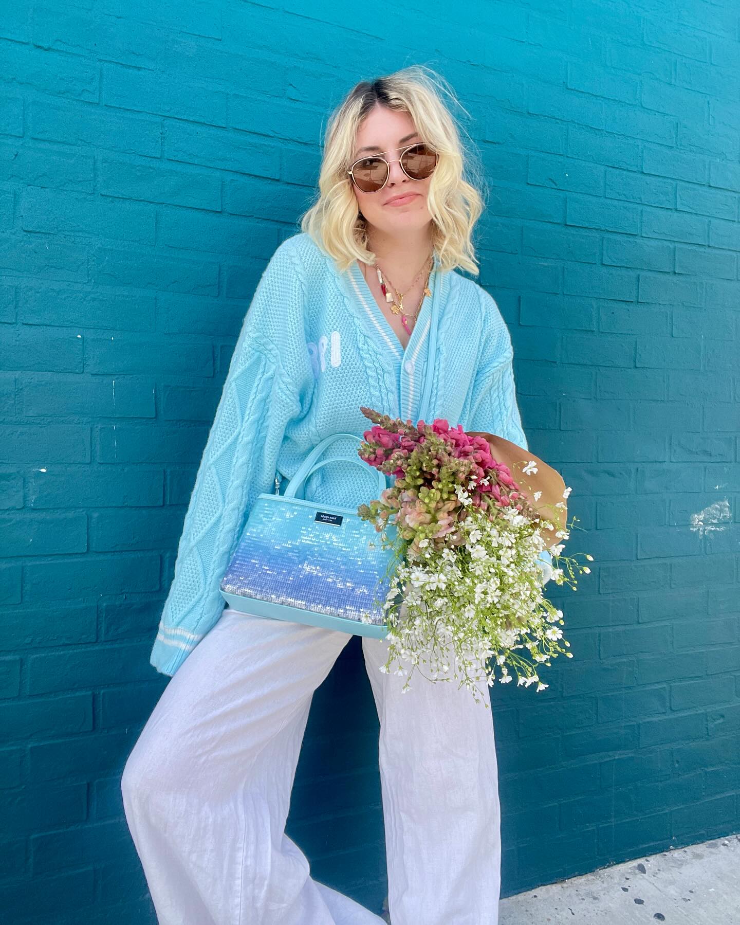 27 Cardigan Outfit Ideas You Need for 2026 23 Baby Blue Cable Knit Cardigan With White Linen Trousers