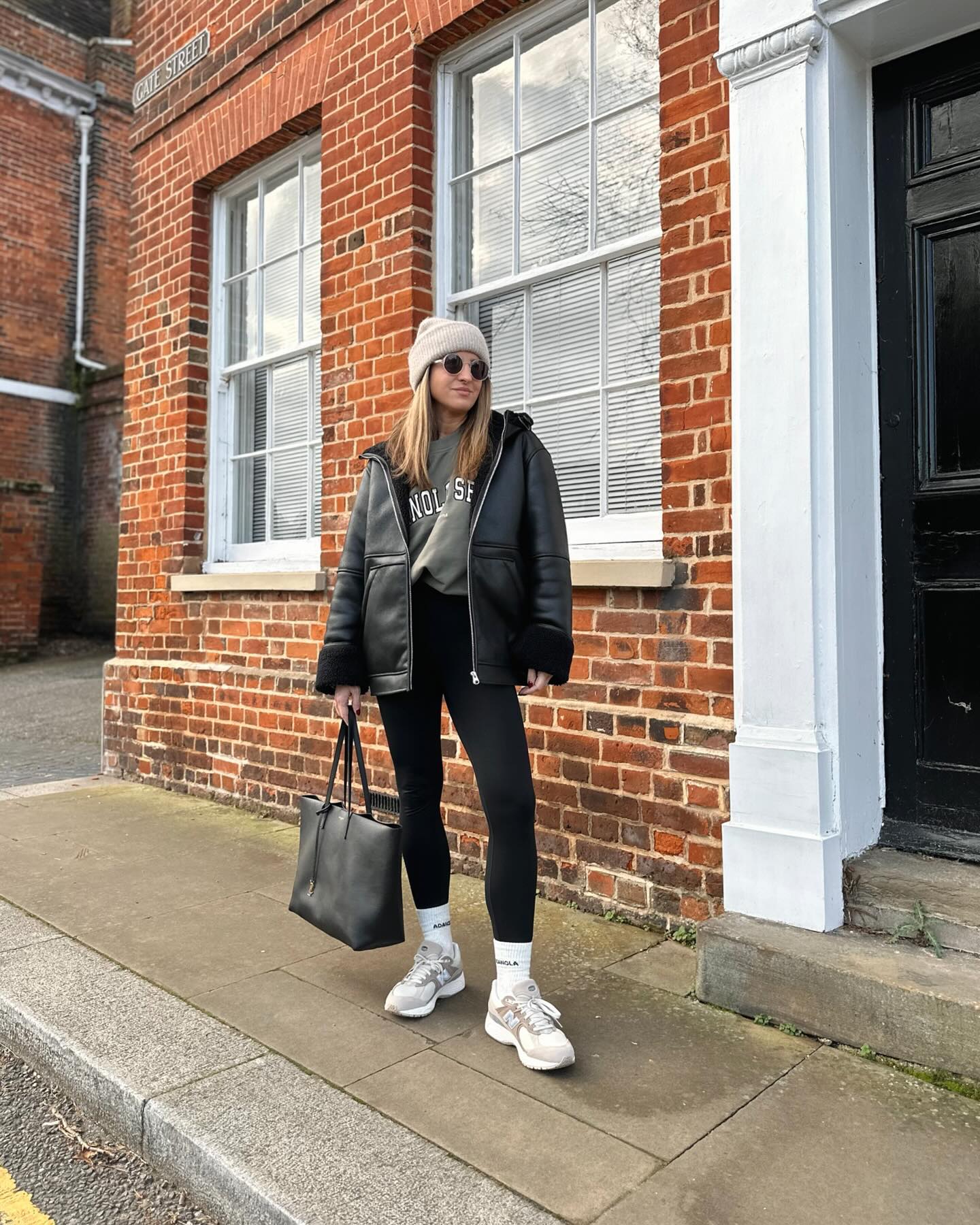 27 Leggings Outfits for 2026 You Need to See Now 13 Black Faux Leather Shearling Jacket & Leggings