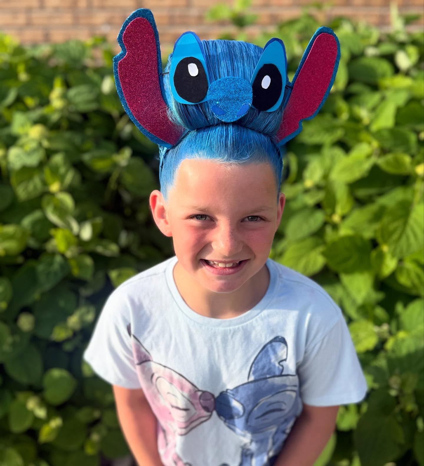 27 Spooktacular Halloween Hairstyles for Kids 2026 17 Blue Stitch Hair Bun Halloween Costume