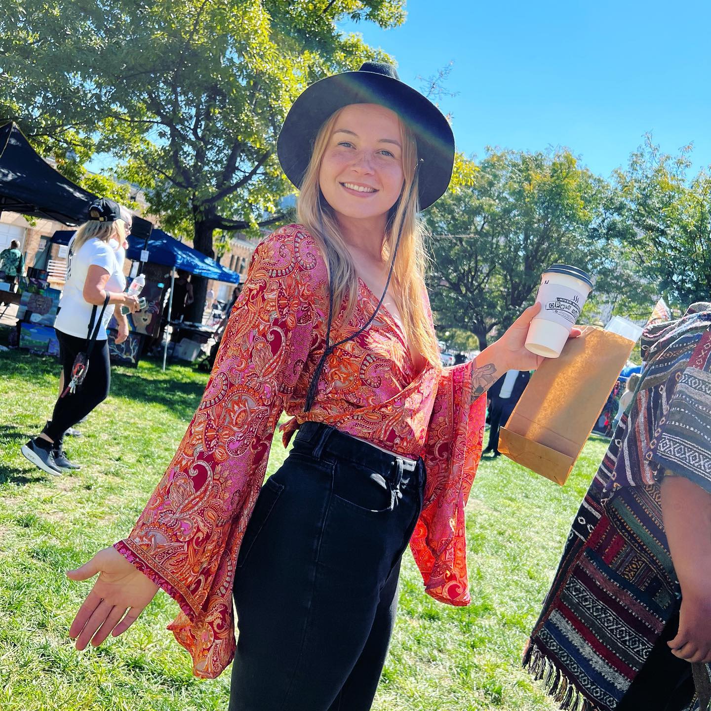 25 Fall Festival Outfits You Need for 2026 11 Boho Paisley Blouse And Black Denim Festival Look
