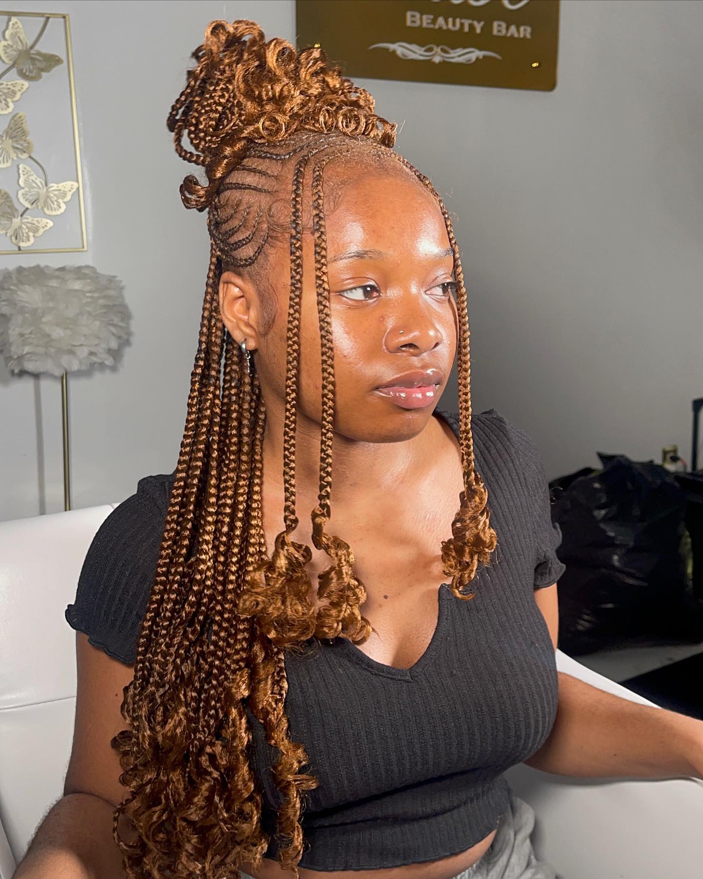 26 Stunning Fulani Braids Hairstyles for 2026 20 Braided Bun With Curly Tendrils And Undercut