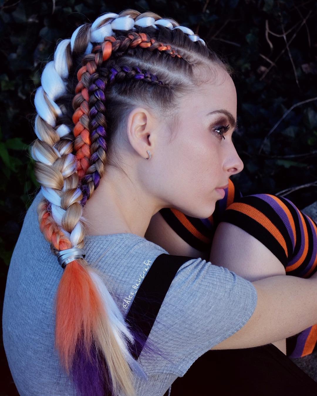25 Spooktacular Halloween Hairstyles You Need to Try in 2026 19 Braided Hair With Fiery Orange, Purple, and Blonde Accents
