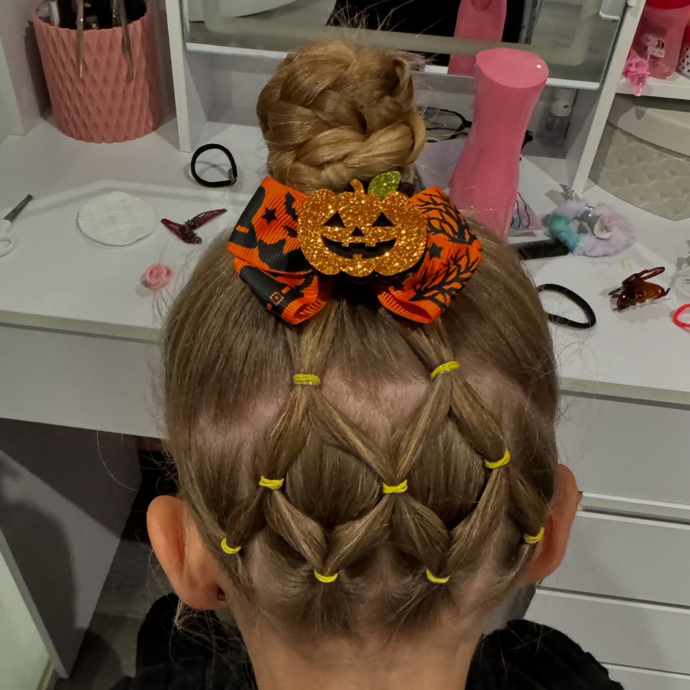 27 Spooktacular Halloween Hairstyles for Kids 2026 11 Braided Pumpkin Patch Updo For Halloween