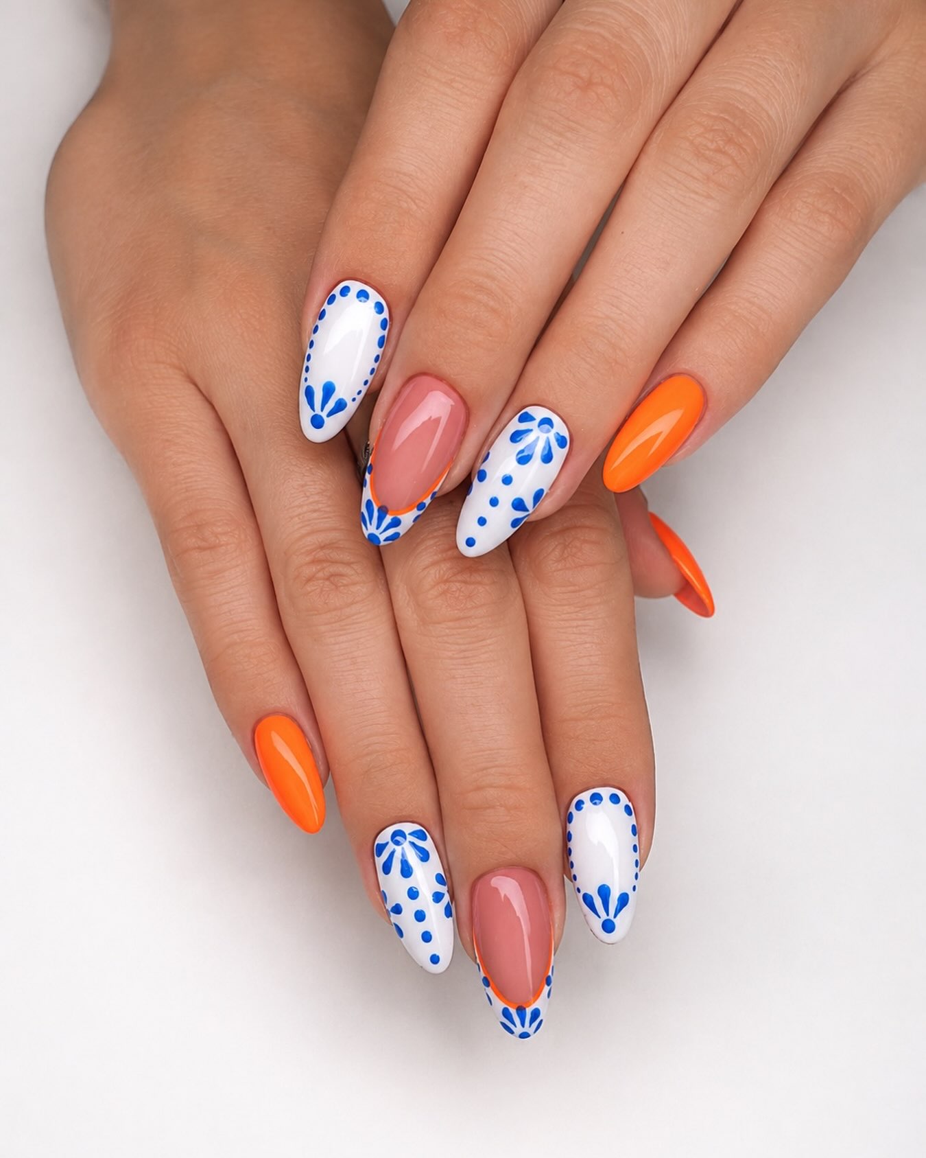 27 End of Summer Nail Ideas for 2026 19 Bright Orange & Blue Folk Art Almond Nails