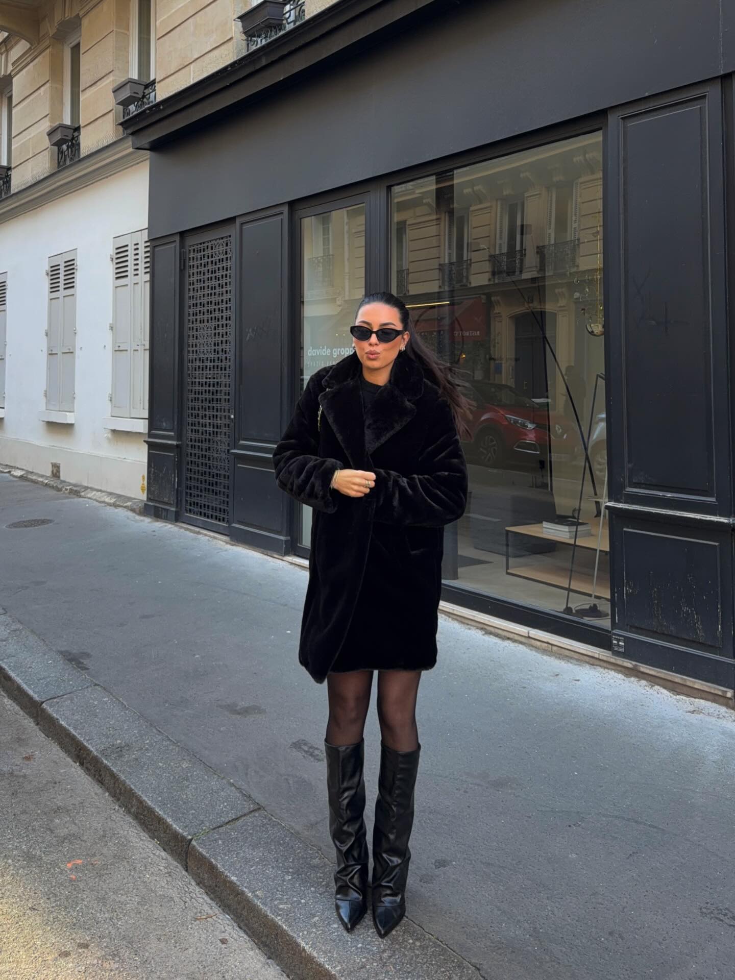 25 Fall Party Outfit Ideas You Need for 2026 8 Chic Black Faux Fur Coat With Knee-High Boots