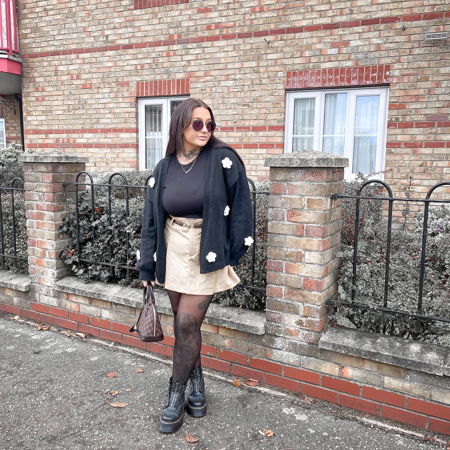 27 Cardigan Outfit Ideas You Need for 2026 5 Chic Floral Cardigan With Mini Skirt and Boots