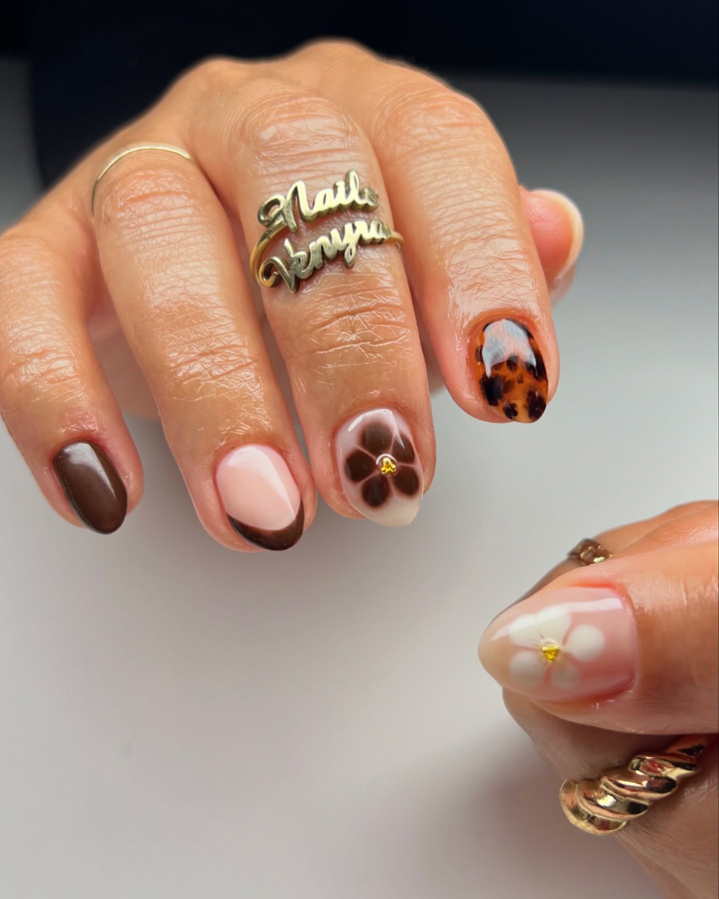 27 Must-Try Short Fall Nail Ideas for 2026 12 Chocolate Tortoiseshell Floral French Mani