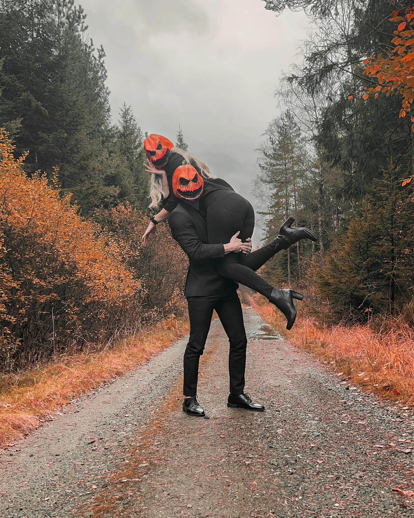 27 Epic Couples Halloween Costumes for 2026 9 Couple's Black Suit Halloween Pumpkin Costume