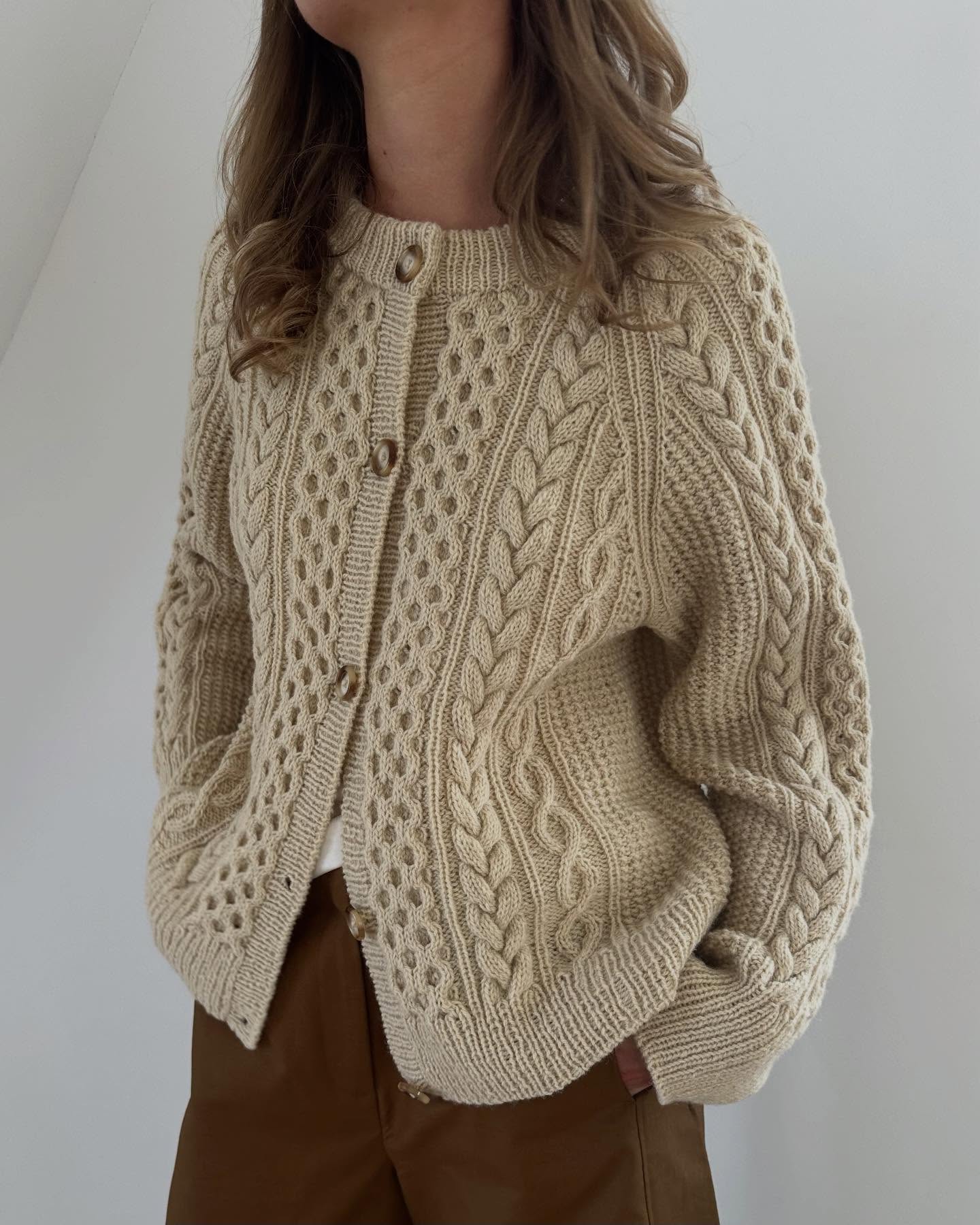 27 Cardigan Outfit Ideas You Need for 2026 17 Cozy Cable Knit Cardigan With Chocolate Trousers