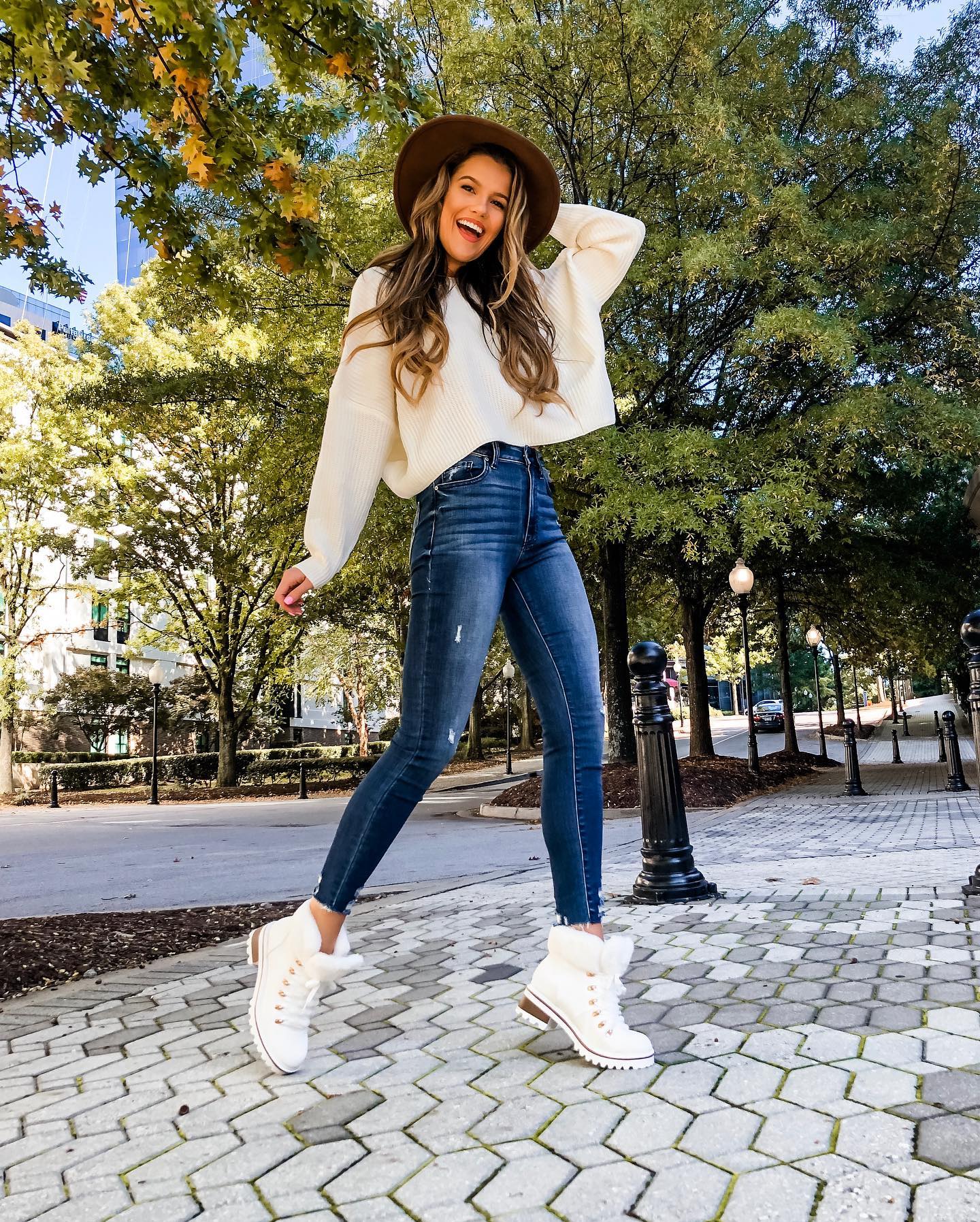 25 Fall Birthday Outfit Ideas You Need for 2026 10 Cozy Cream Sweater And Distressed Denim Outfit