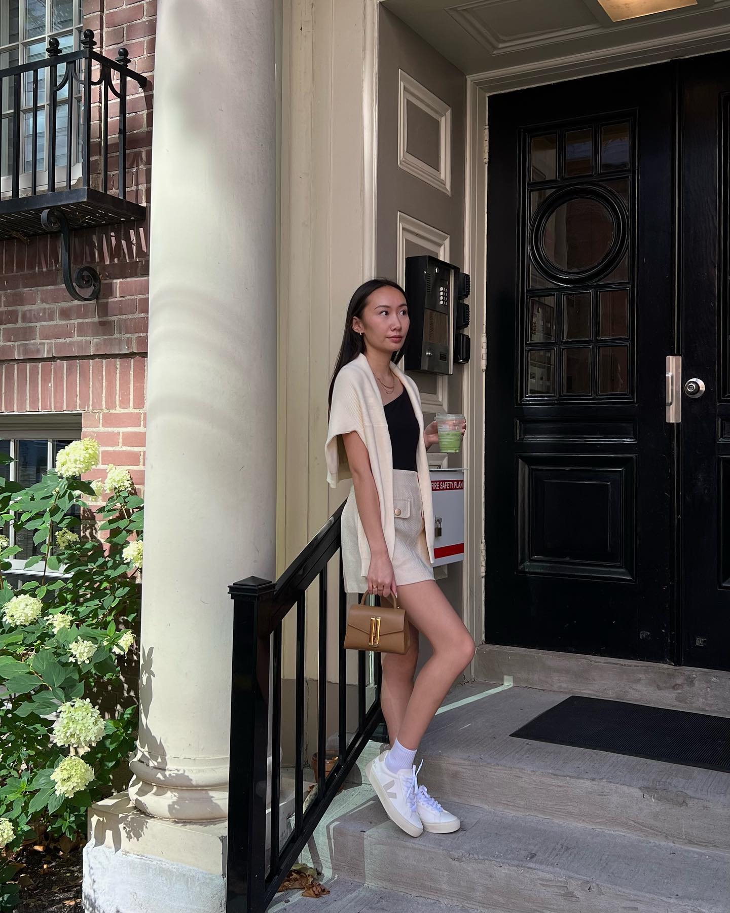 30 Transitional Fall Outfits You Need Now 30 Cream Knit Cardigan Over Black Tank and Linen Shorts