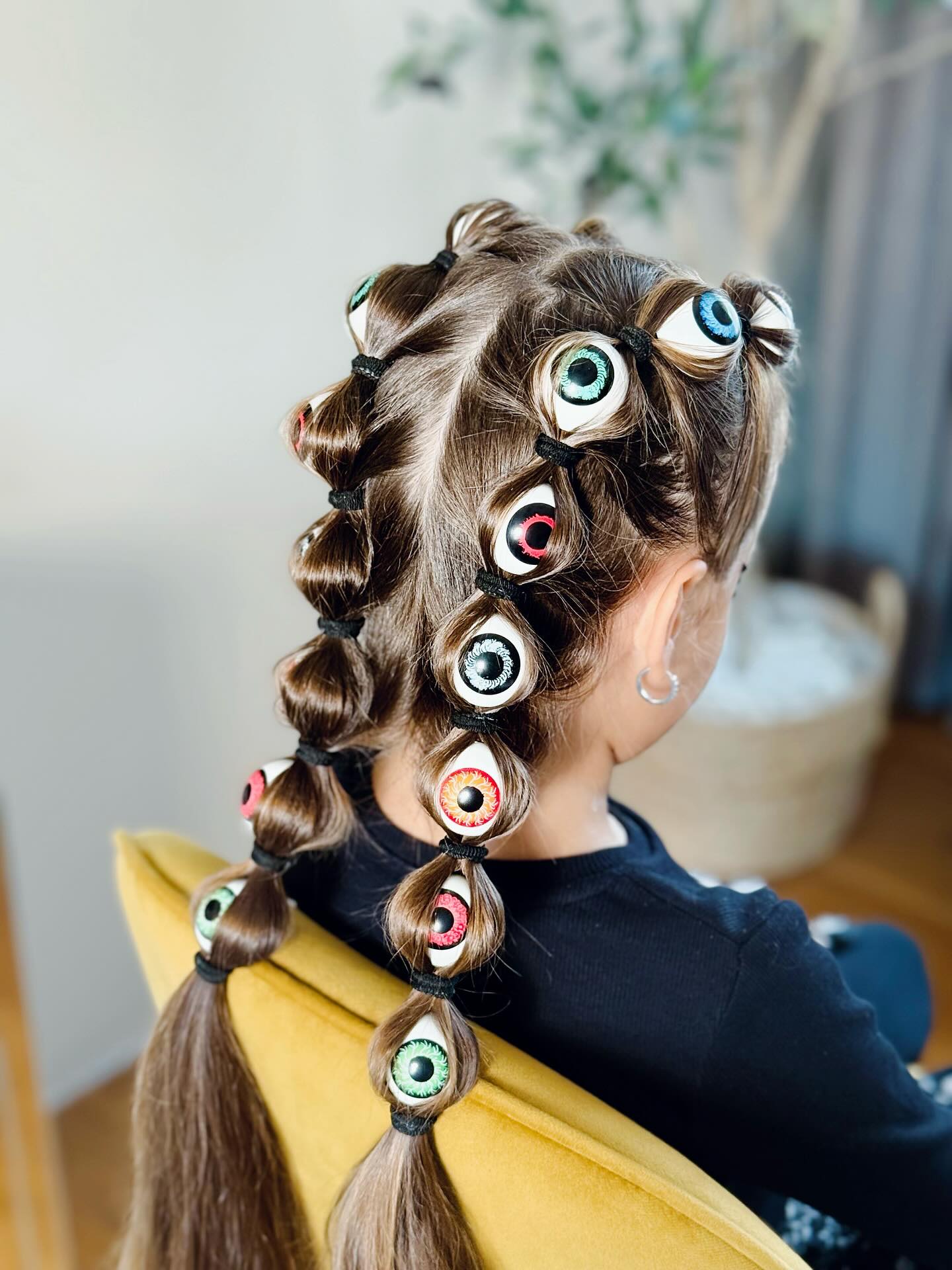 27 Spooktacular Halloween Hairstyles for Kids 2026 12 Creepy Eyeball Bubble Braids Halloween Hairstyle