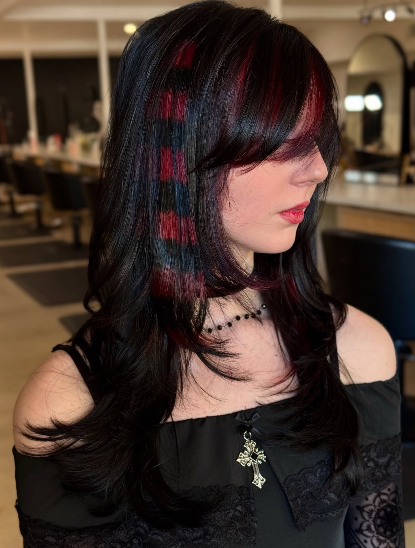 Crimson Peekaboo Streaks On Dark Layered Hair