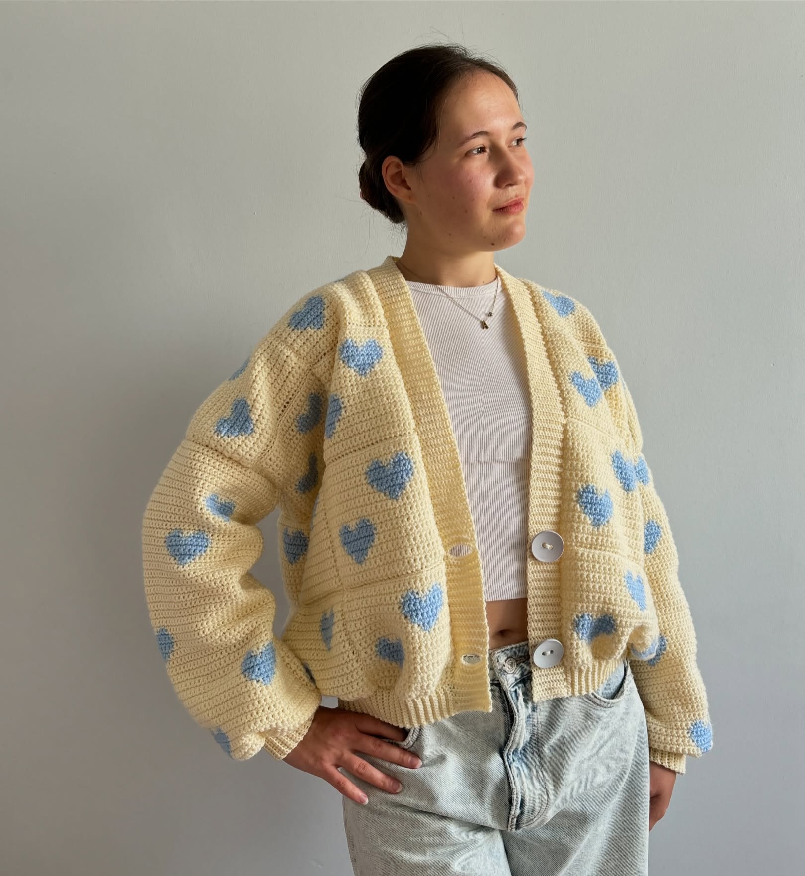 27 Cardigan Outfit Ideas You Need for 2026 16 Crochet Heart Cardigan With Vintage Wash Jeans