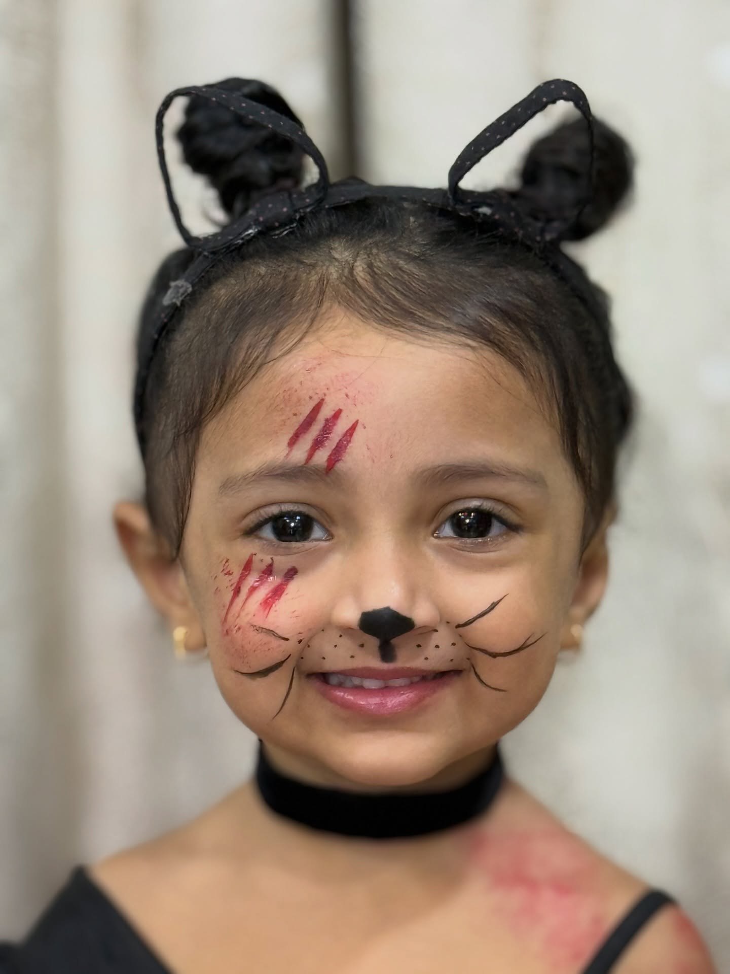 27 Spooktacular Halloween Hairstyles for Kids 2026 14 Cute Cat Buns With Mini Pigtail Ears