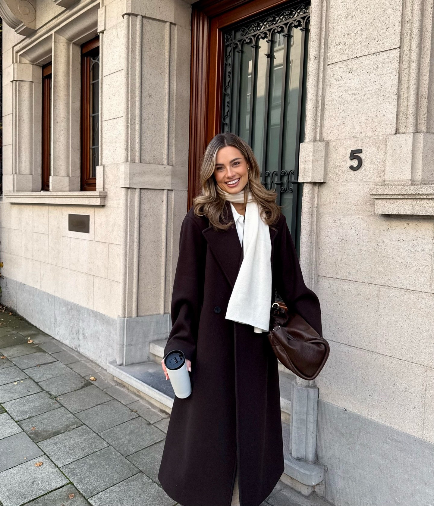 25 Fall Party Outfit Ideas You Need for 2026 5 Dark Chocolate Coat With Cream Scarf Outfit