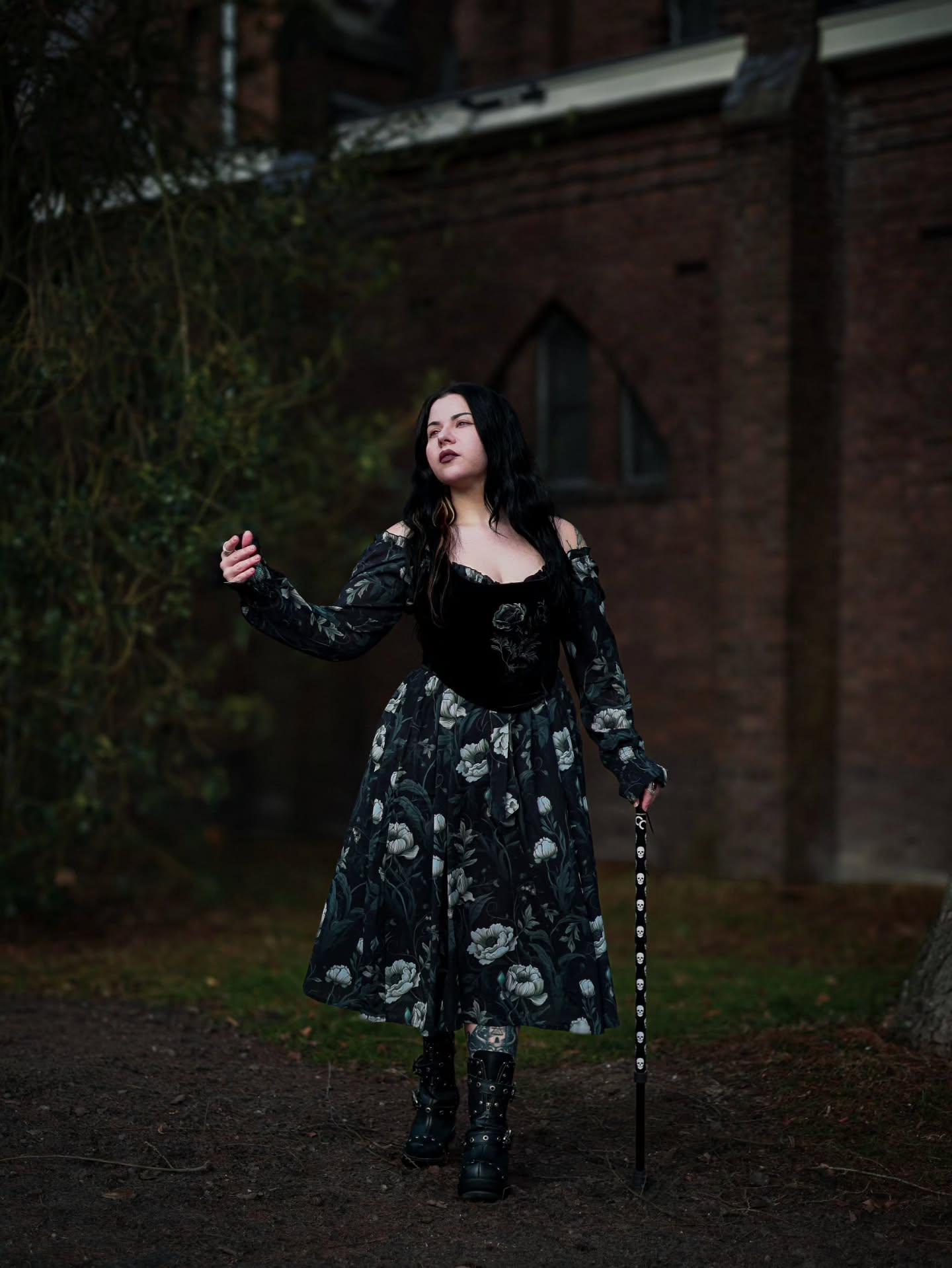 25 Witchy Outfit Ideas for 2026 18 Dark Floral Maxi Dress With Punk Boots