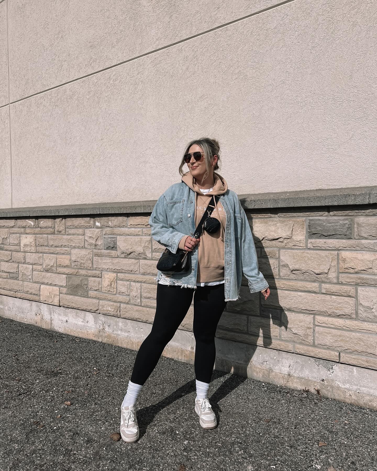 27 Leggings Outfits for 2026 You Need to See Now 17 Denim Jacket Over Hoodie And Leggings Street Style