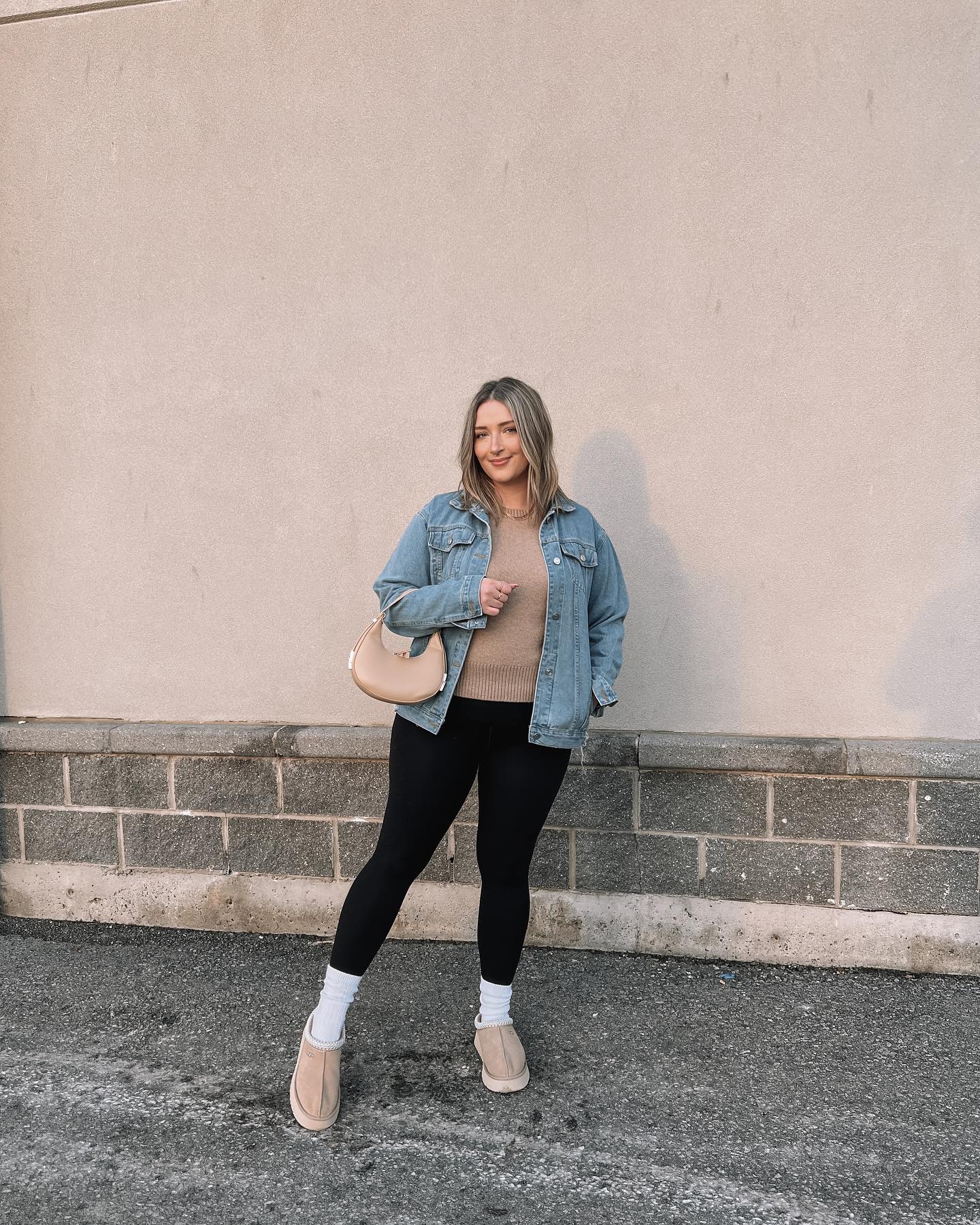 27 Leggings Outfits for 2026 You Need to See Now 20 Denim Jacket With Camel Sweater And Black Leggings