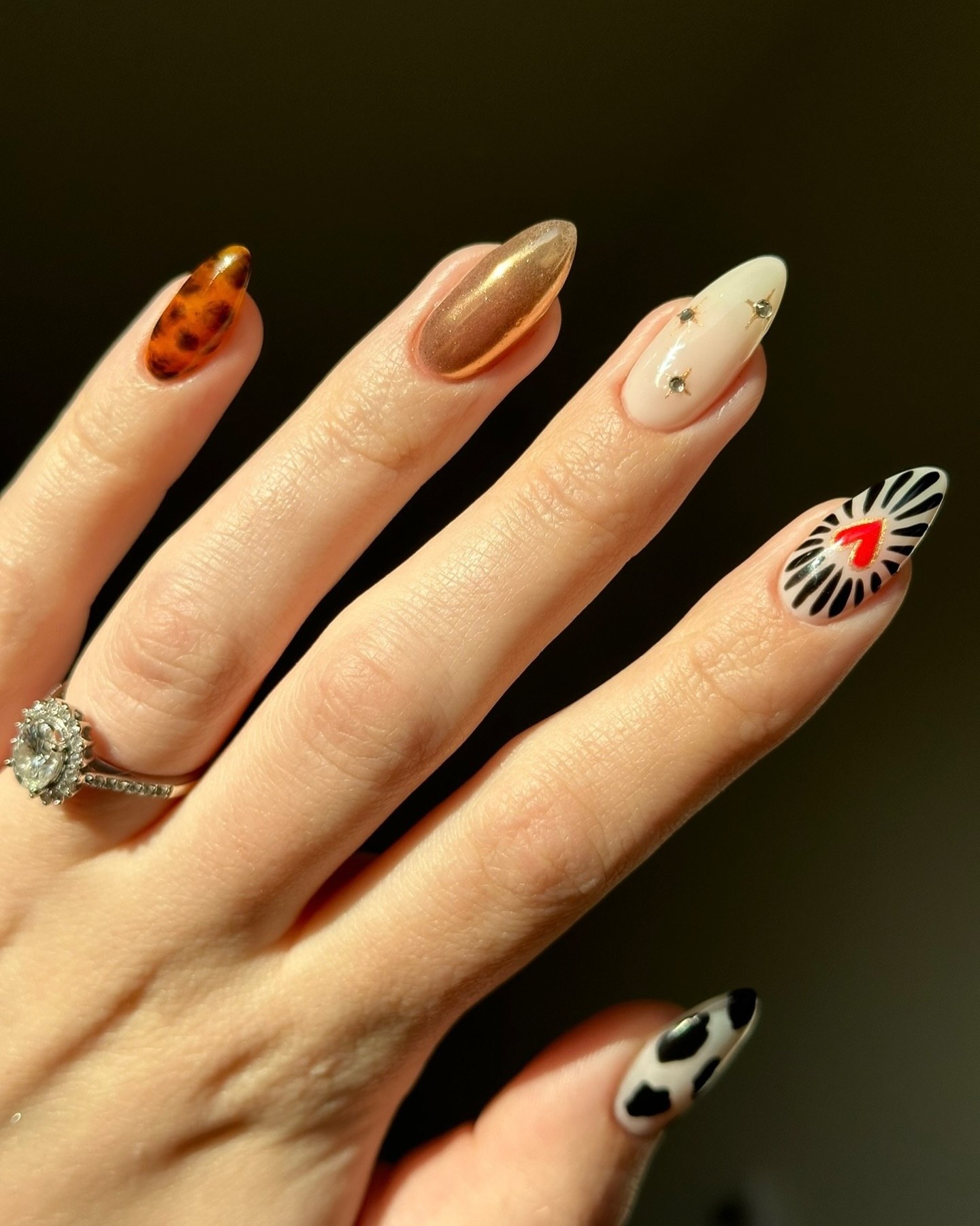 27 September Nails 2026 Trends You Must See 4 Eclectic Mix Almond Nails with Animal Prints and Heart Art